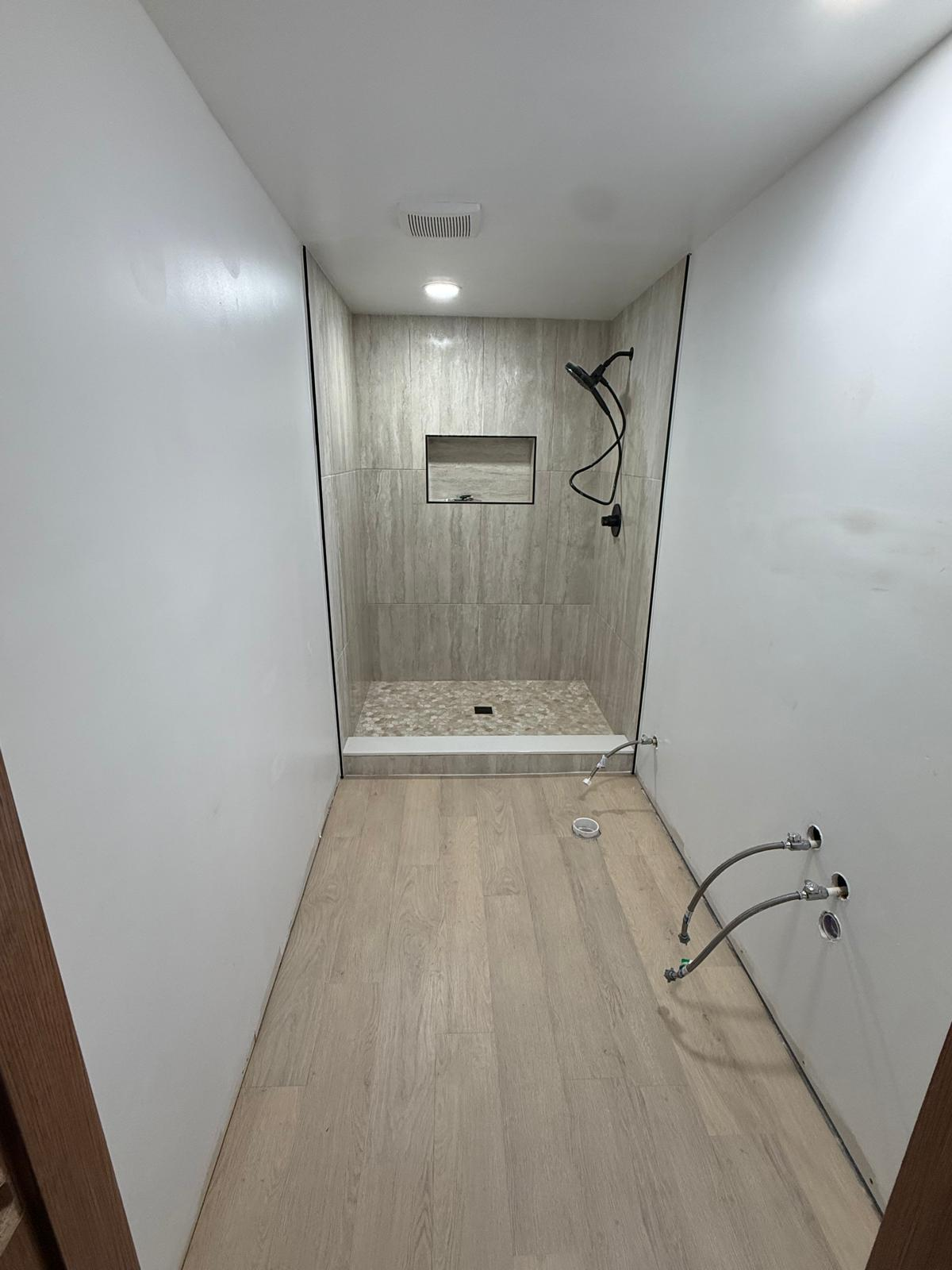 Large-format tile installation with leveling clips, precision tile work