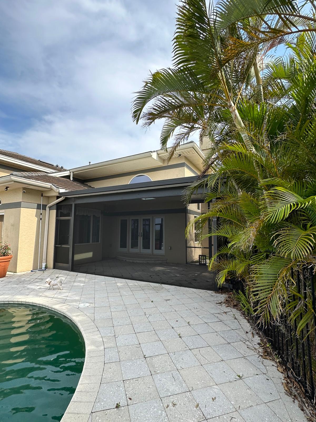 Screened lanai off the pool deck before rebuild