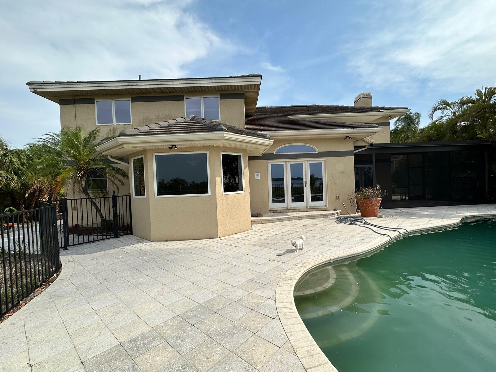 Rear bay window and pool patio before exterior remodel