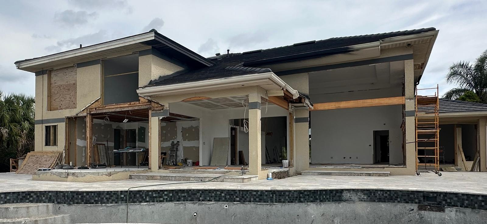 Rear elevation stripped back to framing during a full home remodel